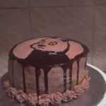 Panda illustration chocolate drip cake Sweet Bakeistan Karachi.