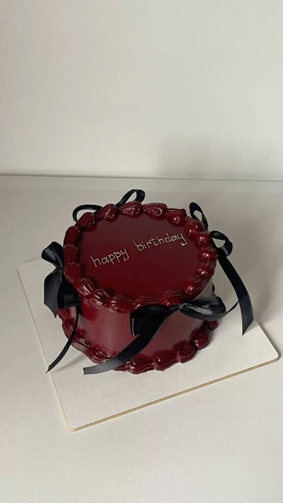 Dark chocolate heart cake happy birthday black ribbon custom Karachi