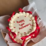Red ribbon cake for anniversary.