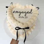 Vintage heart cake with black ribbon.