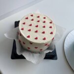 White bento cake with tiny red hearts Sweet Bakeistan Karachi.