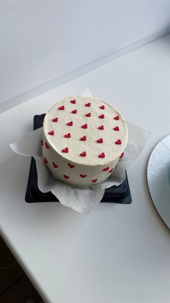 White bento cake with tiny red hearts Sweet Bakeistan Karachi.