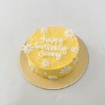 Yellow floral bento cake Sweet Bakeistan Karachi.